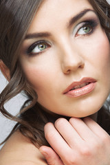 Obraz premium Woman face close up beauty portrait. Girl with long hair lookin