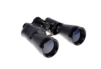 Old vintage binoculars on a white background .