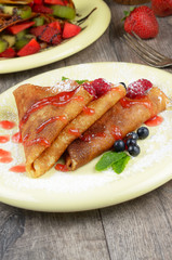 Crepe with raspberries and blueberries