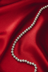 pearls on red silk