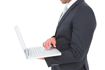 Businessman holding laptop