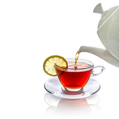 Tea being poured into glass tea cup
