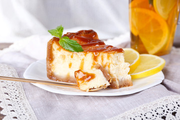 Cheese cake in plate and herbal tea
