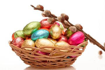 Colourful Easter eggs in a wicker basket