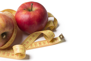 apples with measuring tape isolated