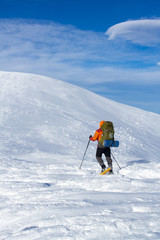 Naklejka na ściany i meble Hiker in winter mountains