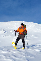 Hiker in winter mountains