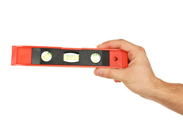 Male hand with ruler level isolated on white