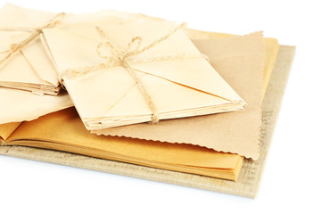 Old letters and book isolated on white