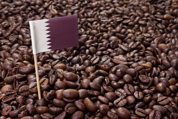Flag of Qatar sticking in coffee beans.(series)