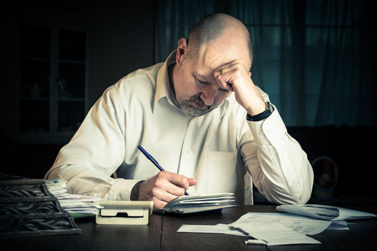 Man working on household finances
