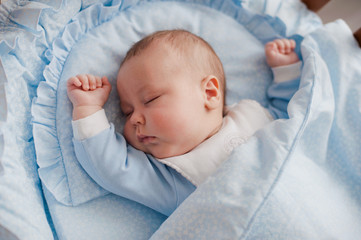 baby sleeps with a cradle