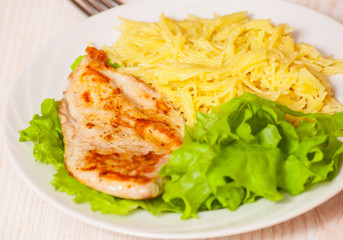 chicken breast with pasta and salad