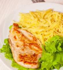 chicken breast with pasta and salad