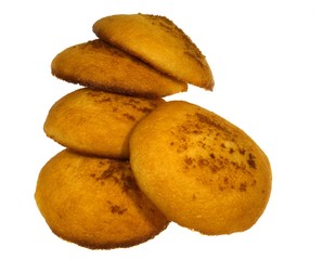 Golden yellow baked Dutch egg cakes over white