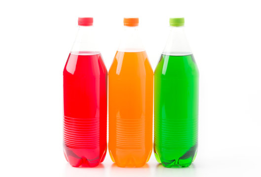 Bottles with soft drinks, isolated on a white background