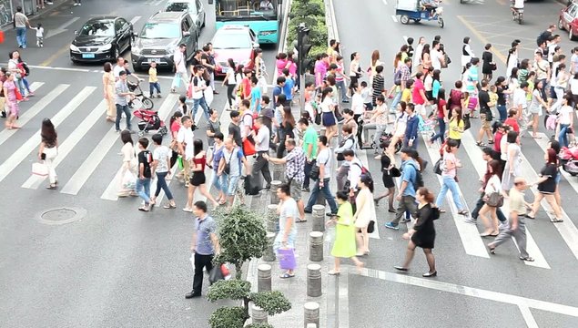 Pedestrians walking over the road crossing