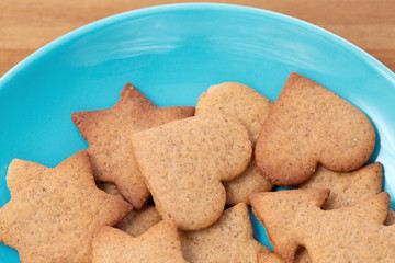 A blue bowl full of homemade cookies