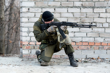 soldier in camouflage uniform