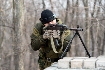 soldier in camouflage uniform