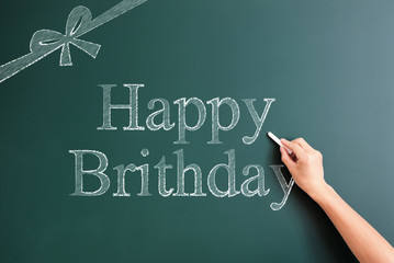 happy birth datwritten on blackboard