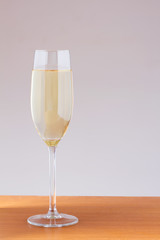 Glass of white wine on a wooden table