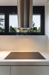 Kitchen, cooker and hood