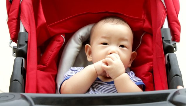 Asian Baby boy in stroller
