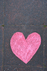 Heart drawn in chalk on a sidewalk