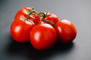 Tomatoes on a black background