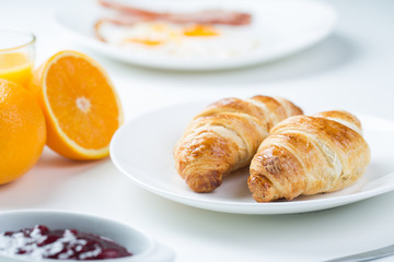 delicious breakfast with croissants and juice