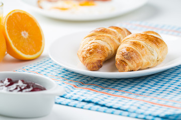 delicious breakfast with croissants and juice