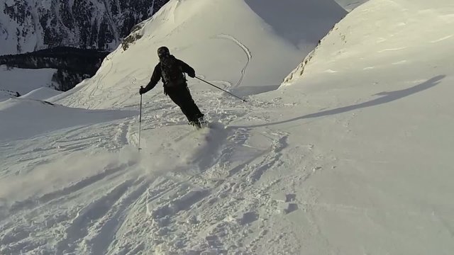 Skier downhill fresh snow