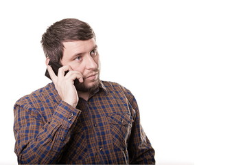 Business man in a plaid shirt talking on the phone isolated on w