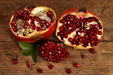 Grenadines with seeds on wooden table