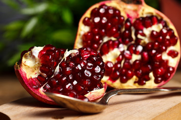 Pomegranate with silver teaspoon