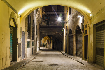 Beautiful narrow street with arch