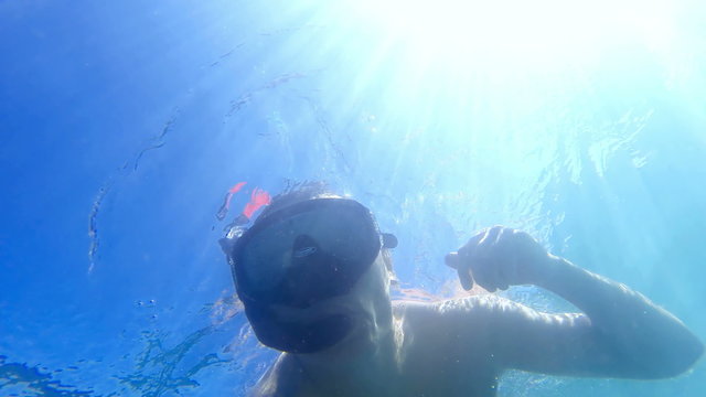 Underwater view of man snorkeling