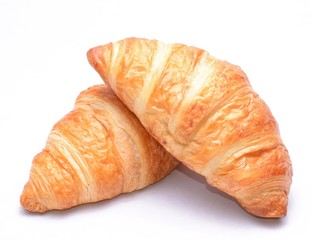 Fresh and tasty croissants on white background
