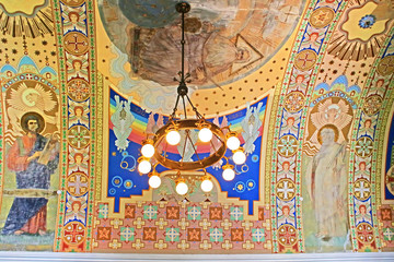 Fototapeta na wymiar Lamp and hand-painted ceiling in Uzhhorod Castle (Ukraine)