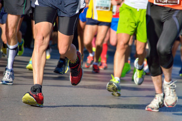 Marathon running race, people feet on road, sport concept