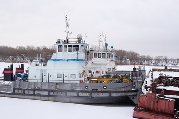 ships in the river port in winter