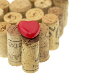Red heart symbol on wine corks form a heart shape