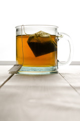 Cup of green tea portrait top center