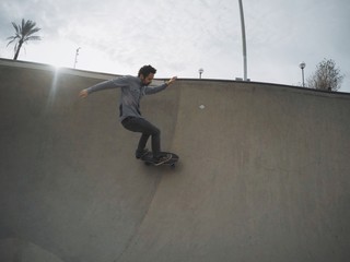 Skater is riding in pool