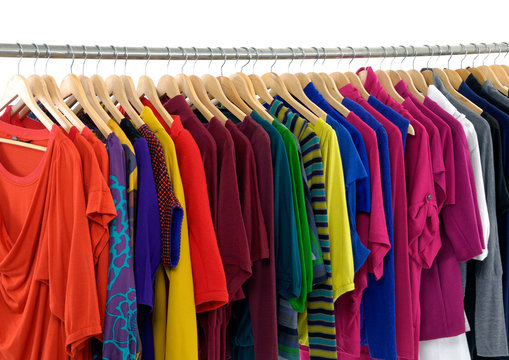 Variety of female colorful clothes on Hangers