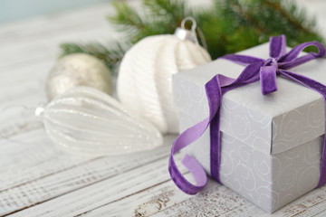 Gift box with violet ribbon