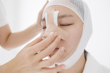 Women undergoing cosmetic surgery of the face