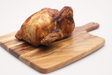 Oven roasted hot chicken on a white background.