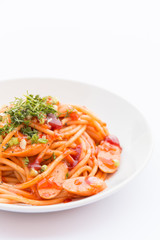 The spaghetti on a white plate.
